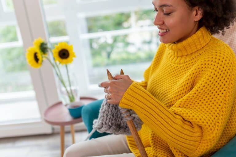 Woman knitting at home